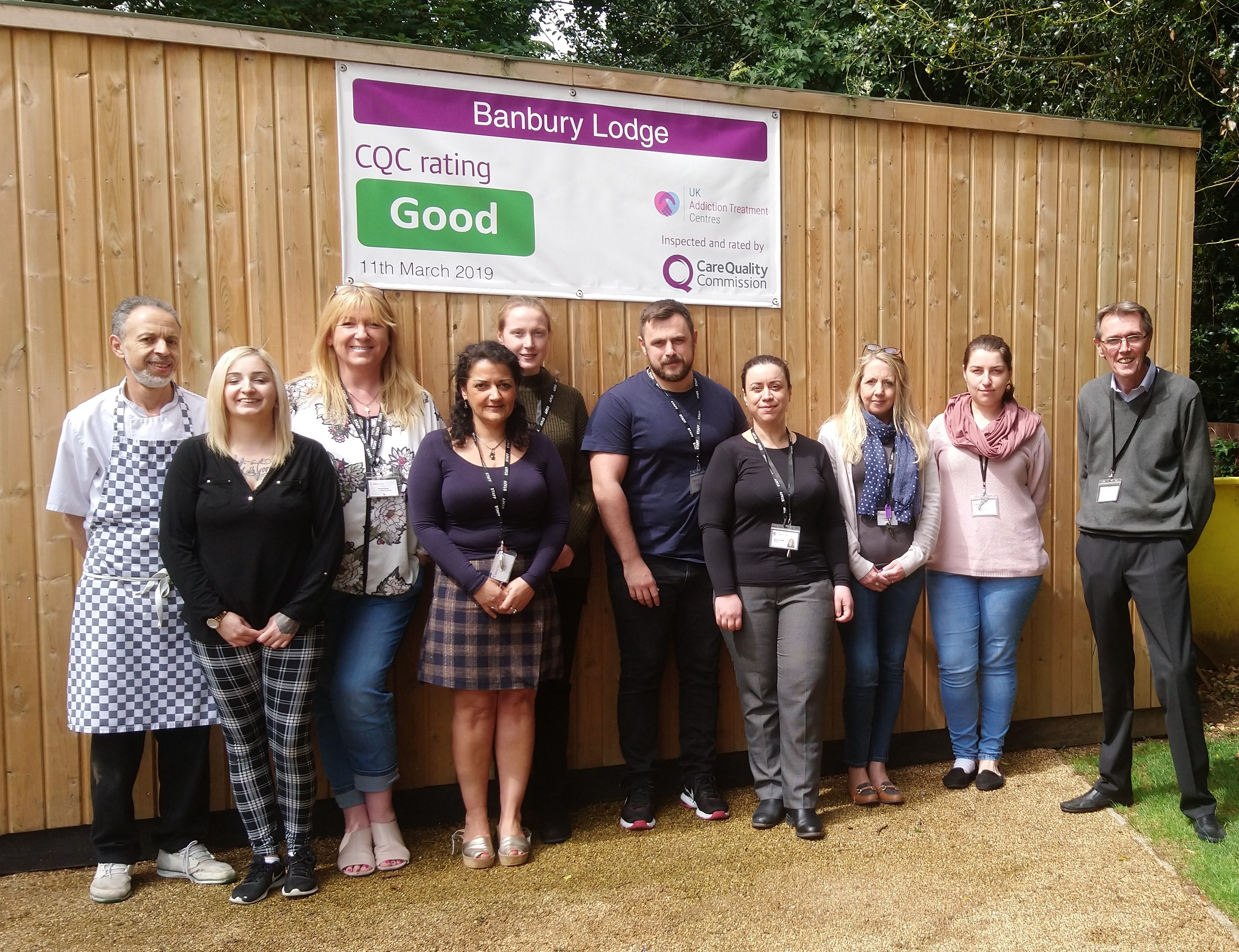 banbury lodge team holding cqc result banner