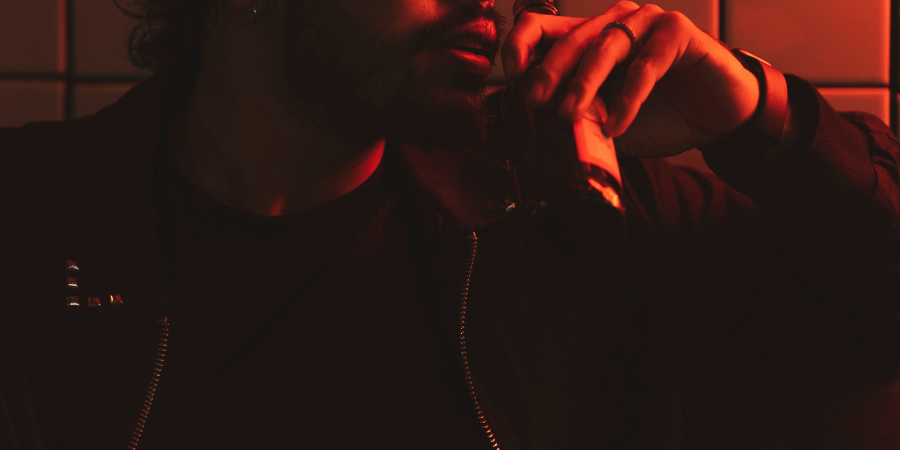 Alcohol-Addiction-Man-Holding-Alcohol