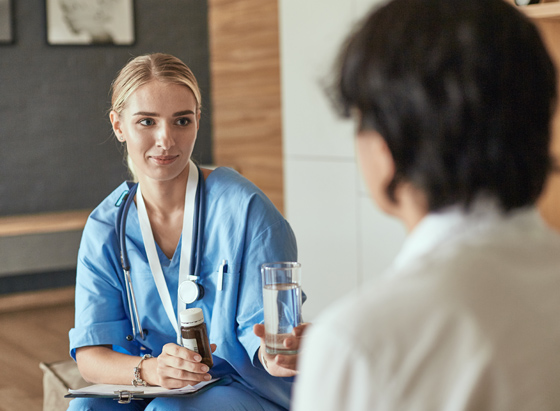 Nurse offering out water