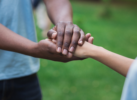 Supporting hands from a loved one