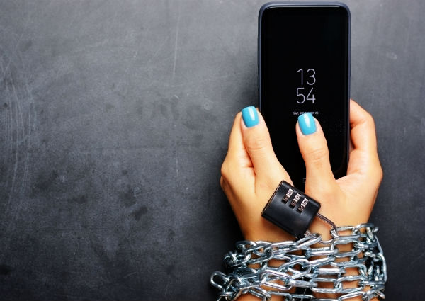 a-photo-of-a-female-being-tied-to-her-smartphone