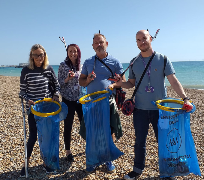 recovery lighthouse team cleaning a beach in worthing