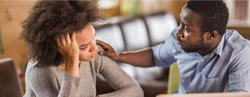 One person comforting another about mental health addiction