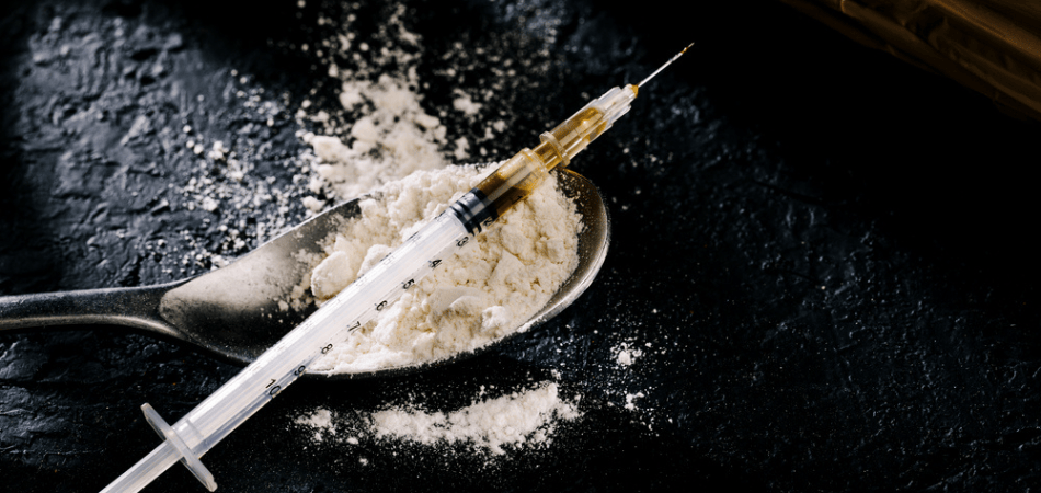 Heroin on a spoon with syringe