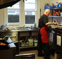 Chef Preparing Food In Kitchen